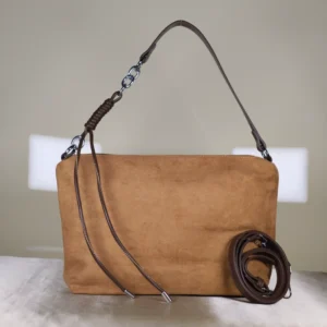 Couple Tote Camel suede shoulder bag with detachable crossbody strap, minimalist design, and spacious zippered compartment.