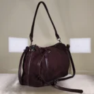 Brown suede shoulder and crossbody bag with adjustable strap.
