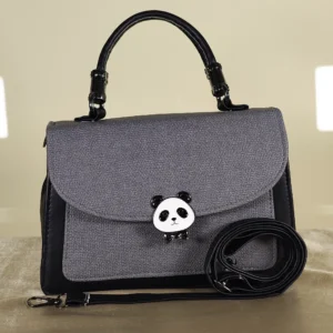 Grey textured top handle satchel bag with panda-shaped twist lock, black accents, and detachable crossbody strap