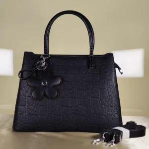 IMG_20260724_155524 Black embossed top handle satchel handbag with detachable shoulder strap and floral charm for women.