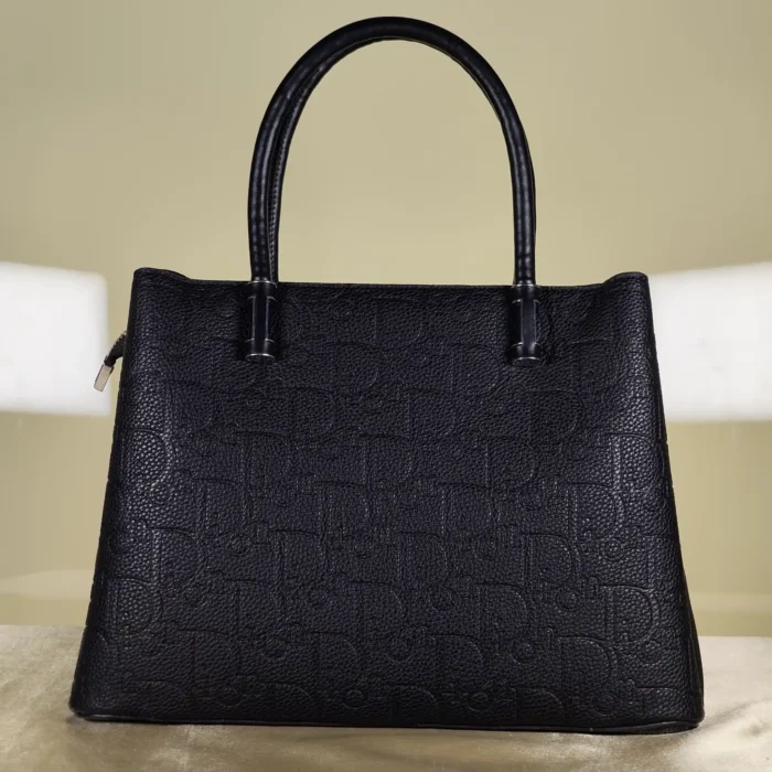 IMG_20260724_155602 Black embossed top handle satchel handbag with detachable shoulder strap and floral charm for women.