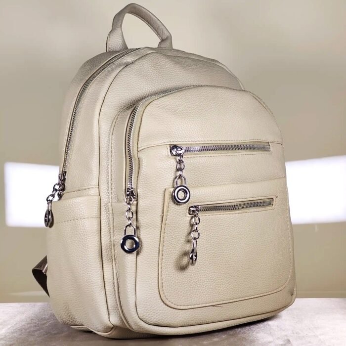 Women's multi-pocket backpack with adjustable shoulder straps, top handle, and multiple zip compartments for everyday use