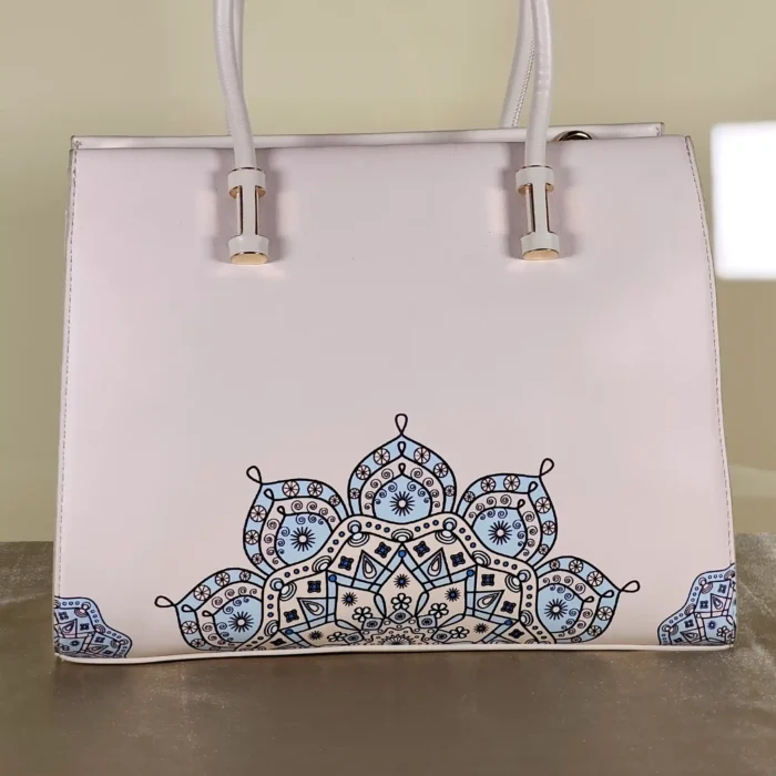 Ivory top-handle tote bag with elegant blue floral-inspired print, structured design, and spacious interior for everyday use