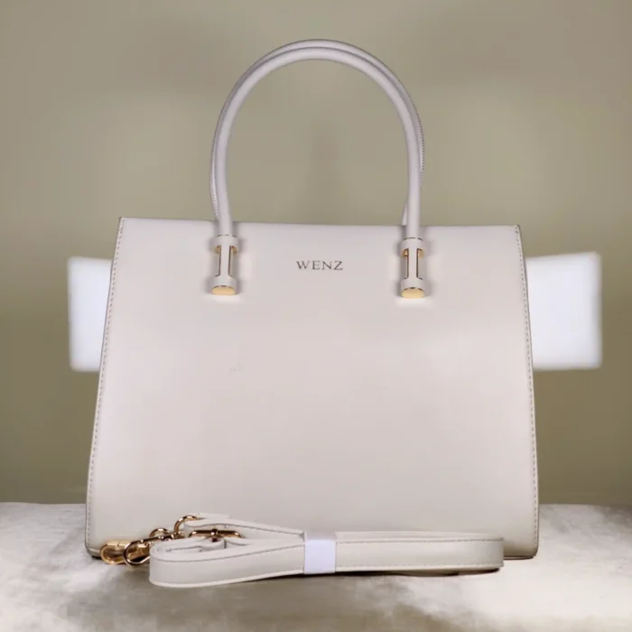 Ivory top-handle tote bag with elegant blue floral-inspired print, structured design, and spacious interior for everyday use