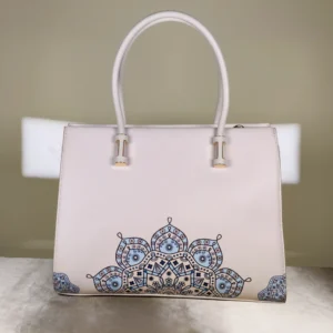 Ivory top-handle tote bag with elegant blue floral-inspired print, structured design, and spacious interior for everyday use