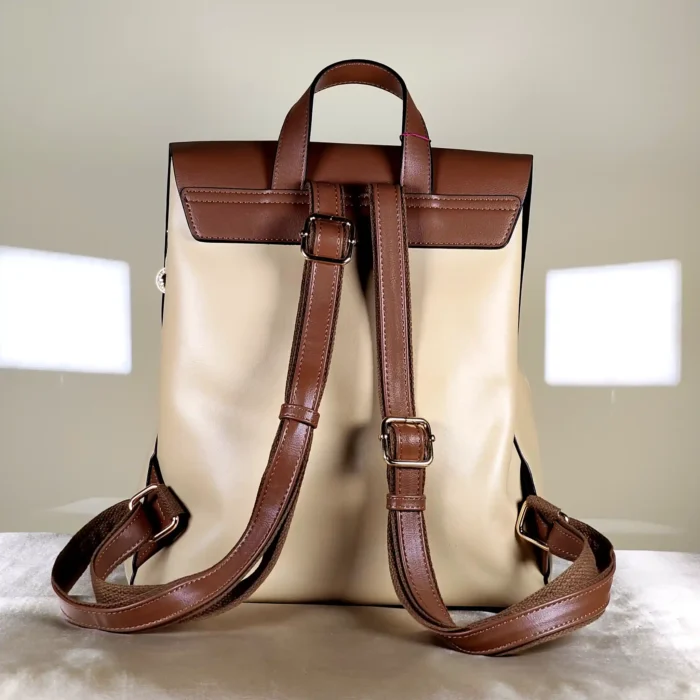 Women's flap backpack with adjustable shoulder straps, top handle, and spacious compartments for everyday use.