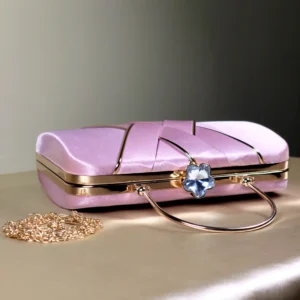A baby pink Elegant structured clutch bag with top handle