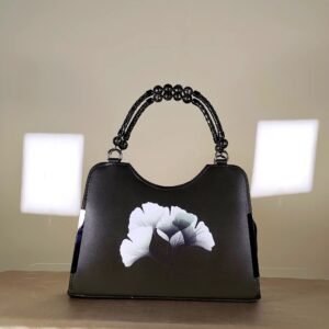 floral printed women's top handle handbag with a decorative beaded handle.