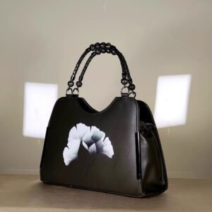 IMG_20260820_145342j floral printed women's top handle handbag with a decorative beaded handle.