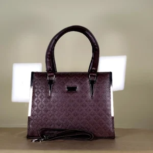 Burgundy patterned top handle tote bag with dark handles and detachable sling strap