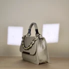 sage green top handle handbag with two-tone chain detail
