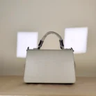 sage green top handle handbag with two-tone chain detail
