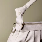 White pleated women's shoulder bag with top handle and detachable strap