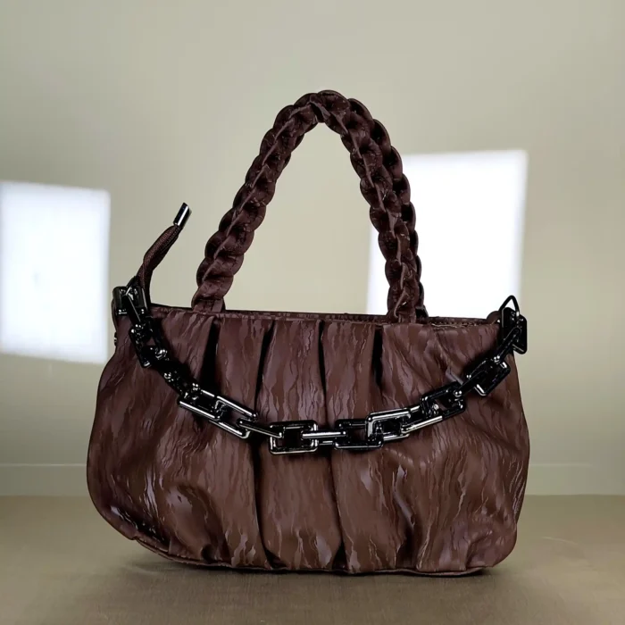 quilted top handle bag with braided handles and silver chain detailing