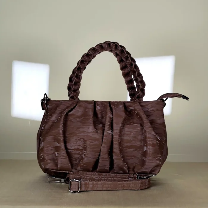 quilted top handle bag with braided handles and silver chain detailing