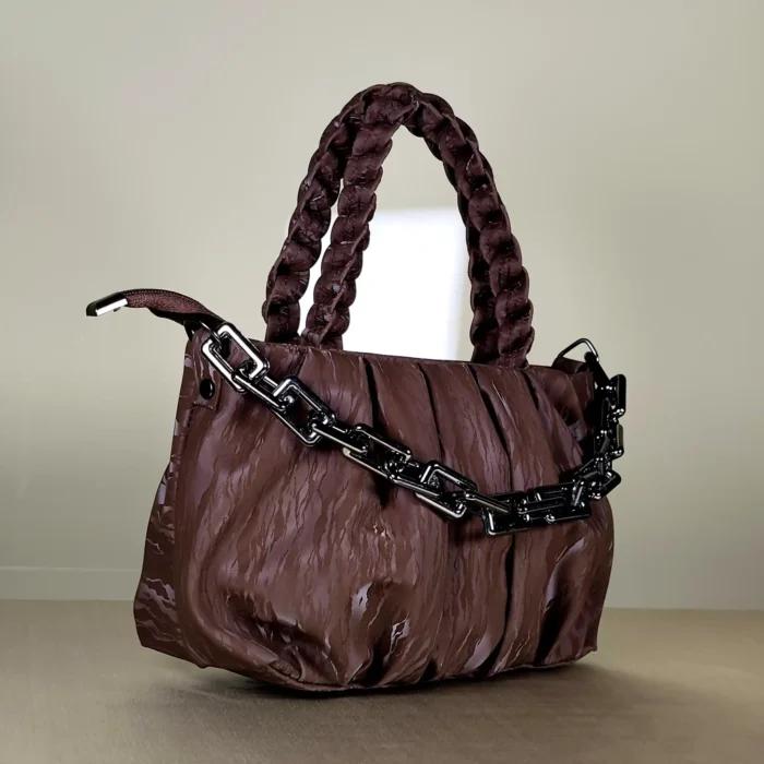 quilted top handle bag with braided handles and silver chain detailing