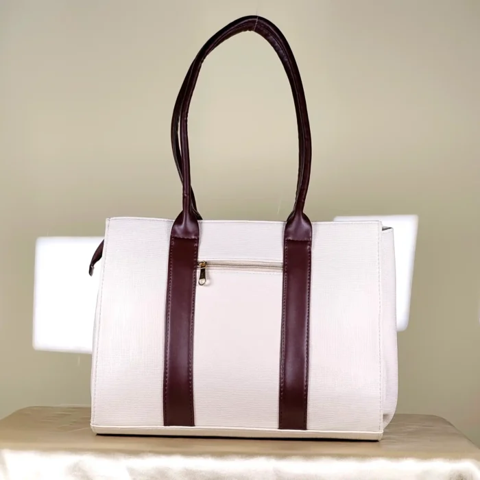 IMG_20260820_153339 Ivory and brown structured tote bag with gold-tone chain-detail handles