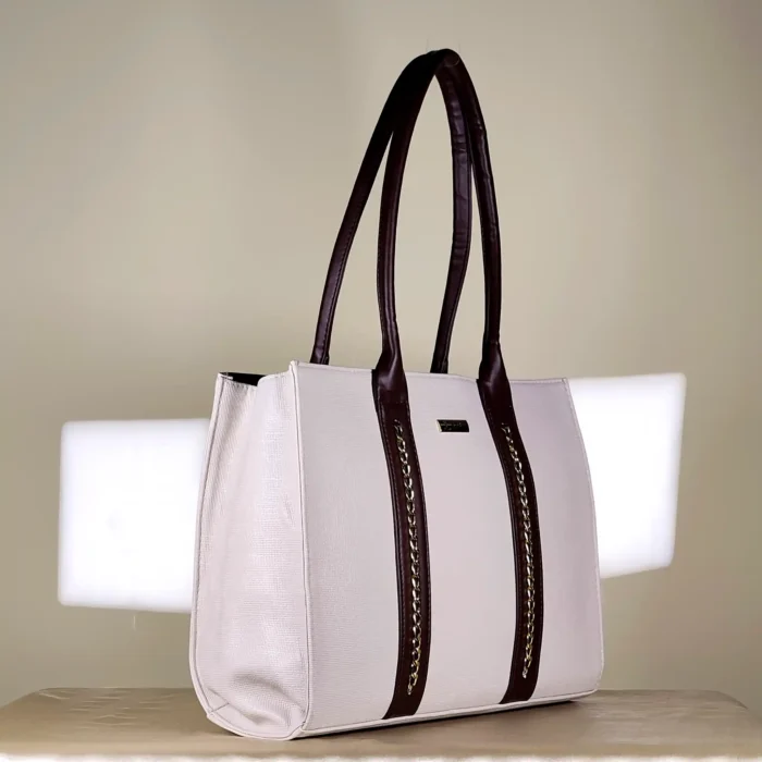 IMG_20260820_153419 Ivory and brown structured tote bag with gold-tone chain-detail handles