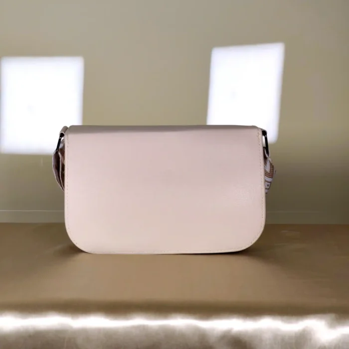 cream crossbody bag with adjustable printed shoulder strap