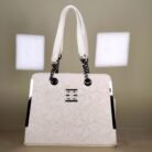 Ivory floral embossed top handle bag with black chain handles