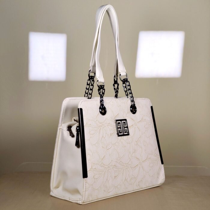 IMG_20260820_165555 Ivory floral embossed top handle bag with black chain handles