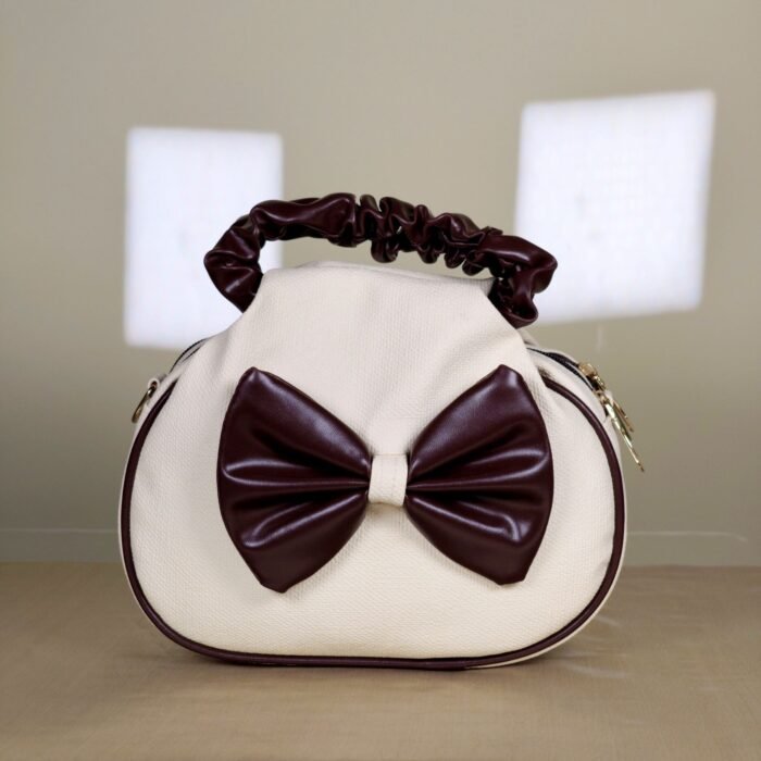 IMG_20260820_165740 Ivory shoulder bag with burgundy bow detail and ruched handle