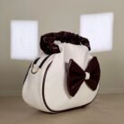 Ivory shoulder bag with burgundy bow detail and ruched handle
