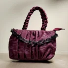 quilted top handle bag with braided handles and silver chain detailing