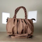 quilted top handle bag with braided handles and silver chain detailing