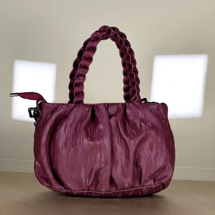 quilted top handle bag with braided handles and silver chain detailing