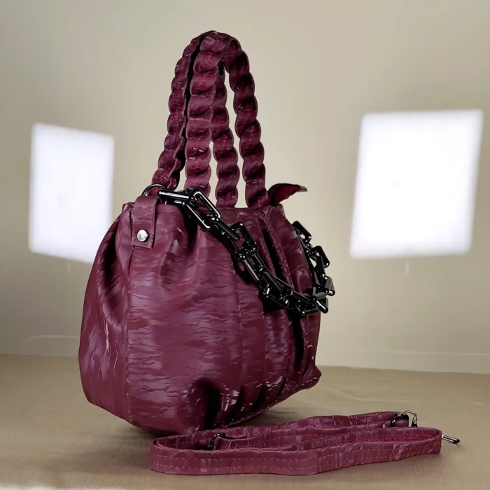 quilted top handle bag with braided handles and silver chain detailing