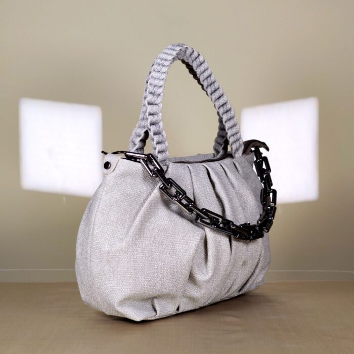 pleated women’s shoulder bag with braided handle and chain detail