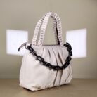 pleated women’s shoulder bag with braided handle and chain detail