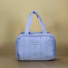 Quilted lunch bag with dual handles and zip closure
