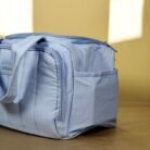 Quilted lunch bag with dual handles and zip closure