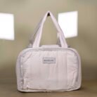 Quilted lunch bag with dual handles and zip closure
